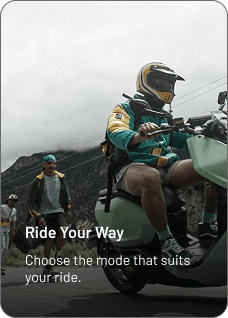 Riders travelling through a mountain landscape on a P2